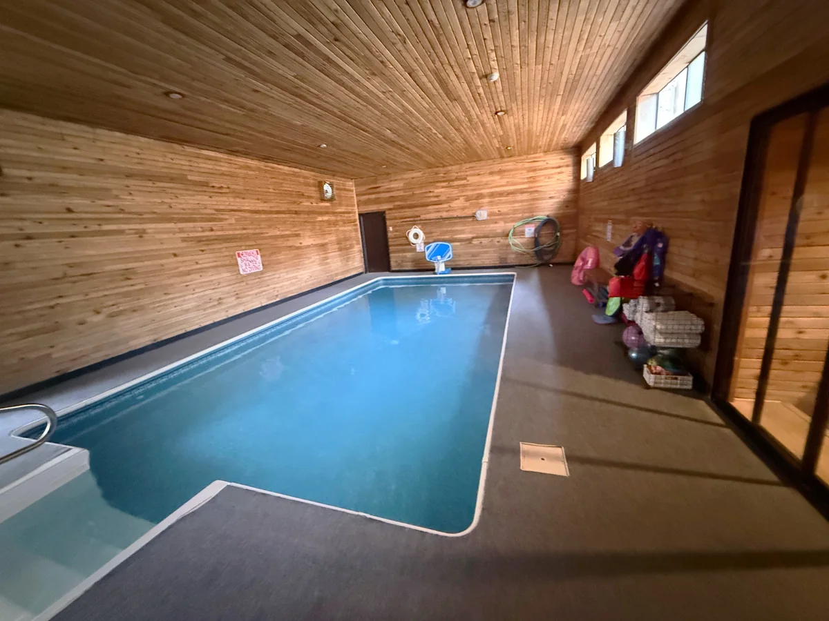 Indoor pool room cleaned and reset for property use