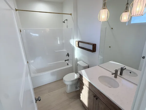 Bathroom shower, tub, and nearby surfaces cleaned