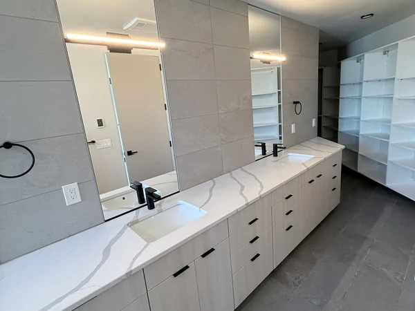 Bathroom vanity, mirrors, and floor cleaned for a finished reset