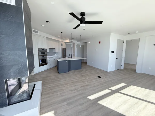 Empty living and kitchen area cleaned for a property handoff