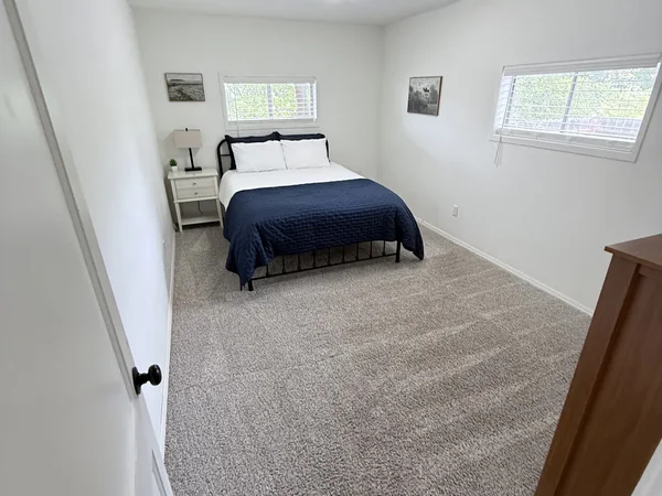 Bedroom cleaned with carpet and surfaces reset