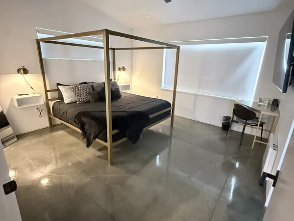 Bedroom cleaned with floors and surfaces reset